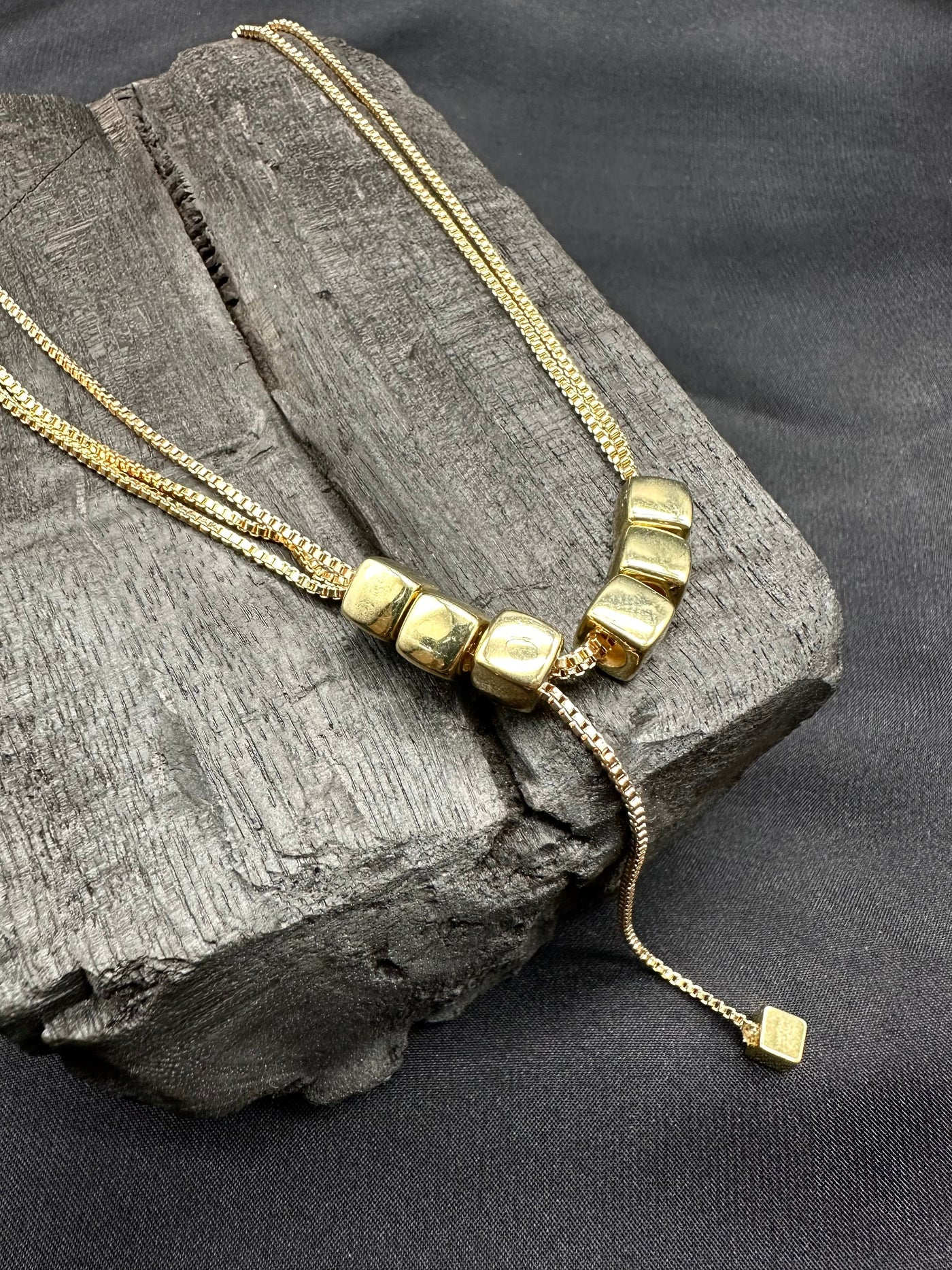 Golden square grid necklace